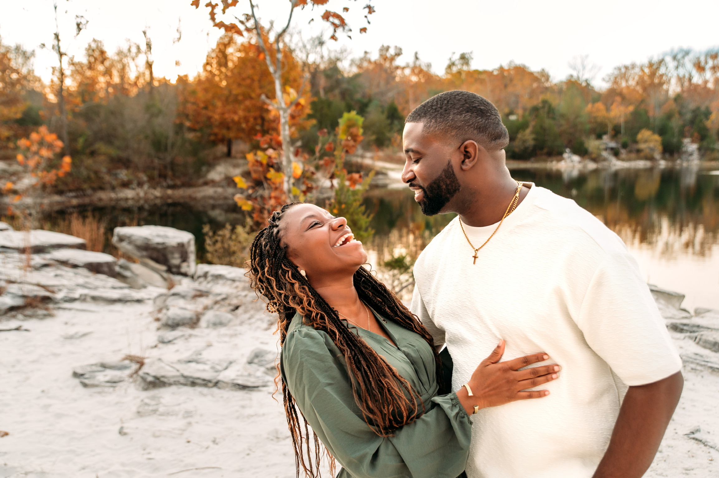 Calvin and Kneisha sharing a smile beside the lake