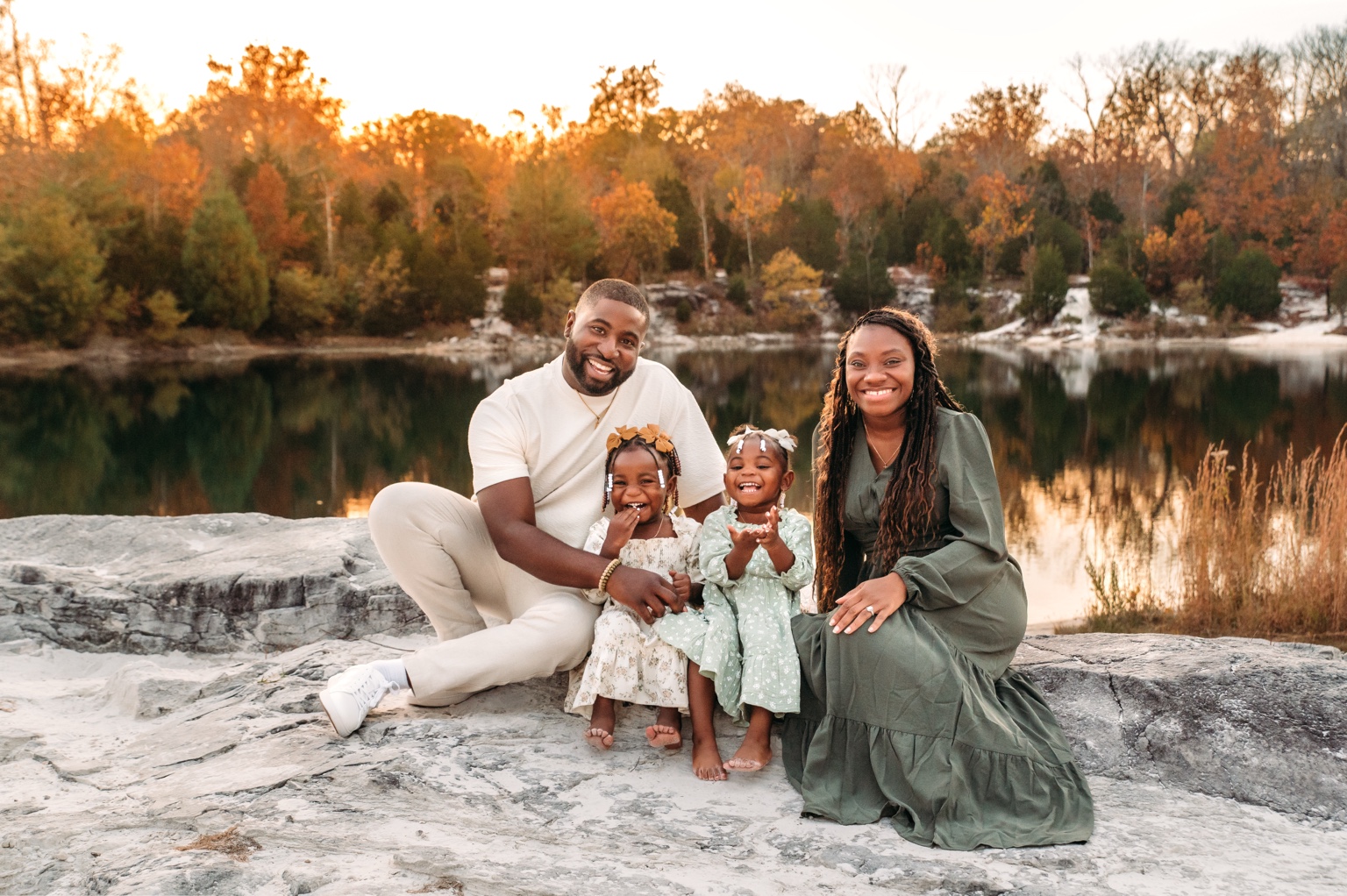 Calvin, Kneisha, and their daughters beside the lake